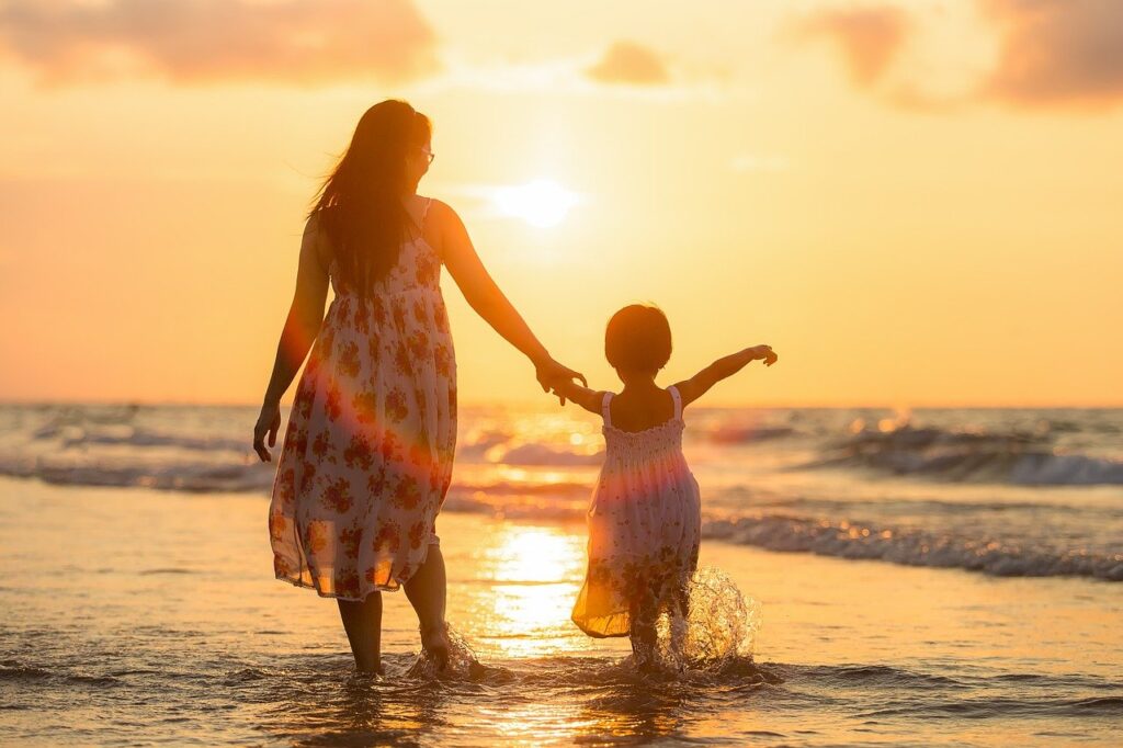 Mother and daughter walking on the beach | Fitness for kids in Bangalore